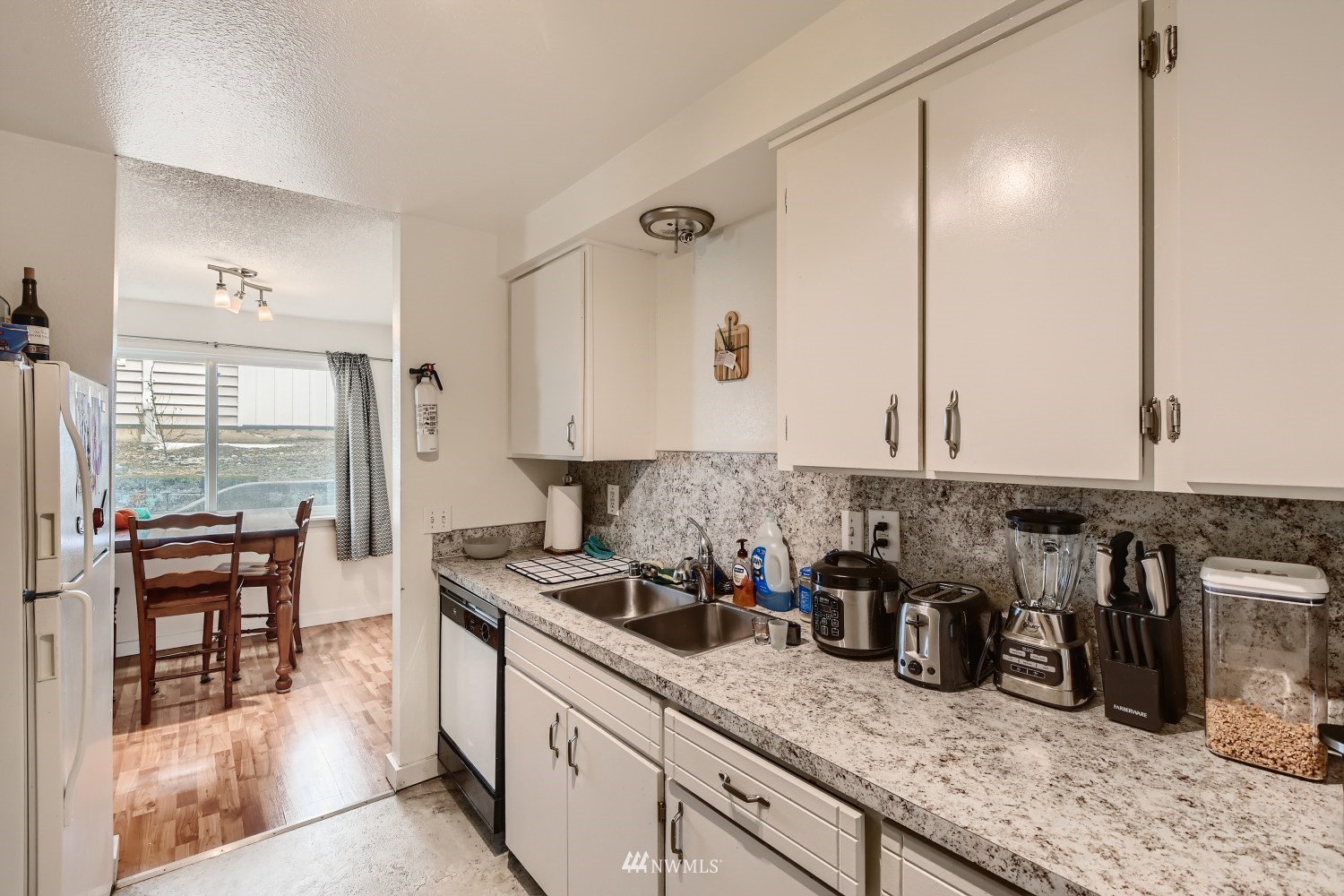 3325 Rockefeller Avenue Everett, WA 98201 - Photo 14 of 32 a kitchen with lots of counter top space and furniture