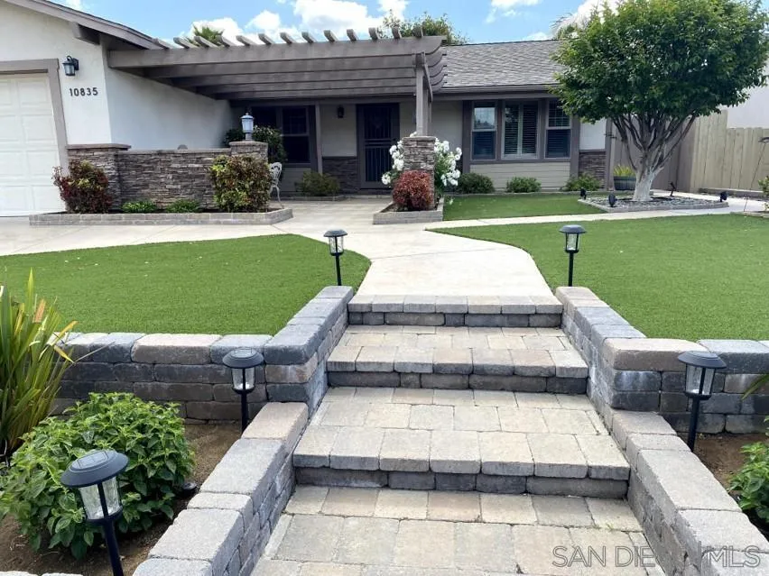 10835 Singletree Lane Spring Valley, CA 91978 - Photo 1 of 31 a front view of a house with garden
