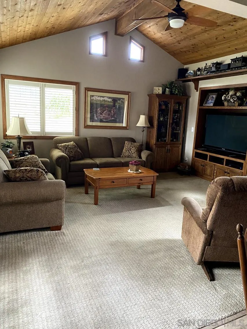 10835 Singletree Lane Spring Valley, CA 91978 - Photo 11 of 31 a living room with furniture and a flat screen tv