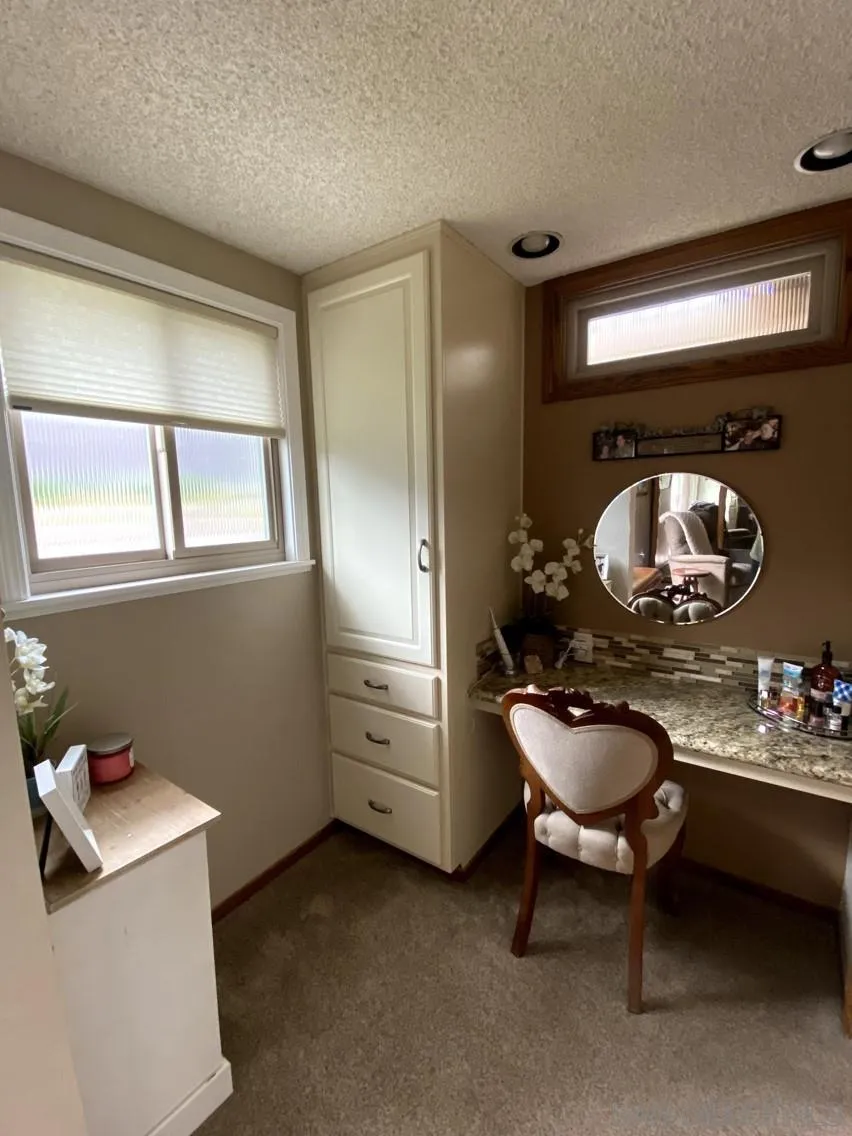 10835 Singletree Lane Spring Valley, CA 91978 - Photo 13 of 31 a room with furniture and chandelier