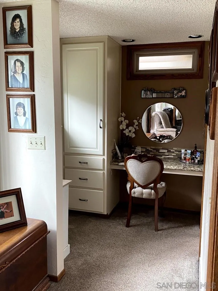 10835 Singletree Lane Spring Valley, CA 91978 - Photo 14 of 31 a living room with furniture and a mirror