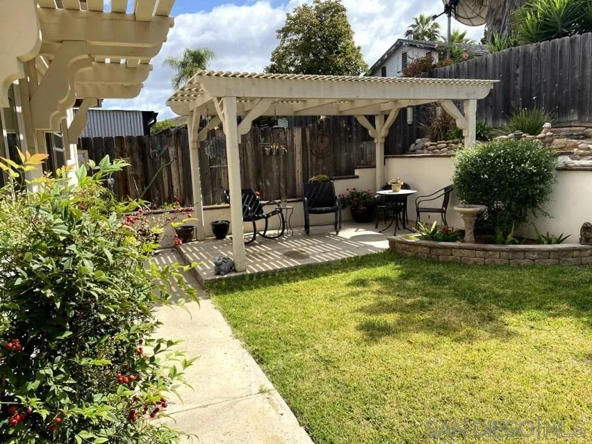 10835 Singletree Lane Spring Valley, CA 91978 - Photo 15 of 31 a view of a house with swimming pool and sitting area