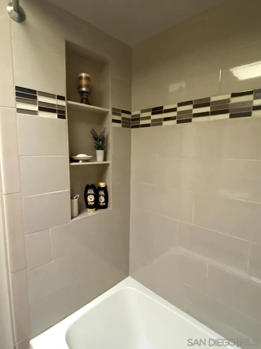 10835 Singletree Lane Spring Valley, CA 91978 - Photo 19 of 31 a bathroom with a shower and a ceiling fan