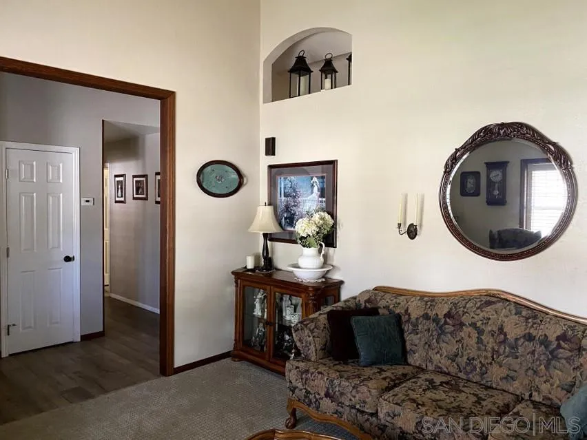 10835 Singletree Lane Spring Valley, CA 91978 - Photo 29 of 31 a living room with furniture and a mirror