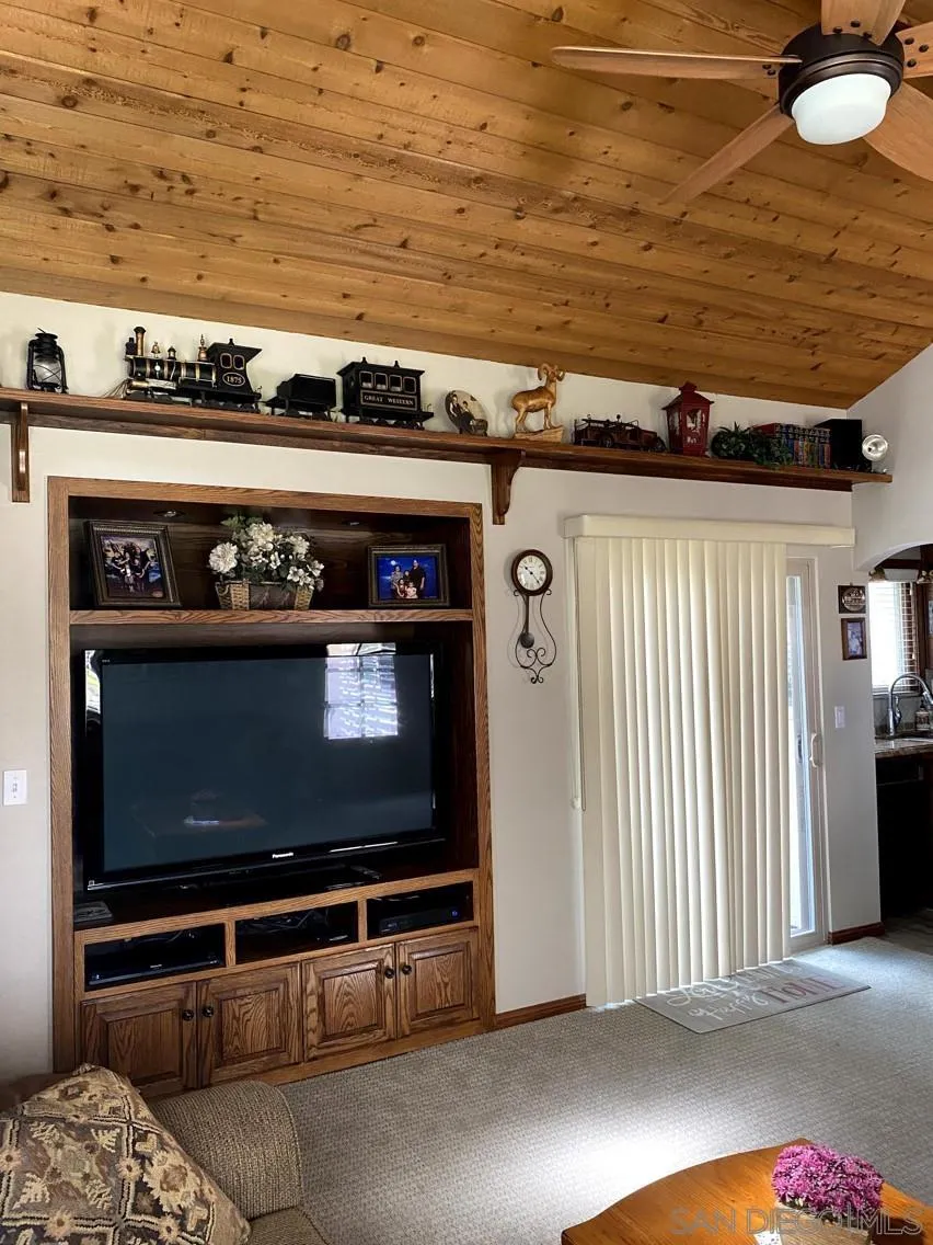 10835 Singletree Lane Spring Valley, CA 91978 - Photo 30 of 31 a living room with furniture and a fireplace