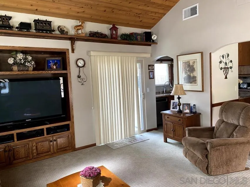 10835 Singletree Lane Spring Valley, CA 91978 - Photo 31 of 31 a living room with furniture and a flat screen tv