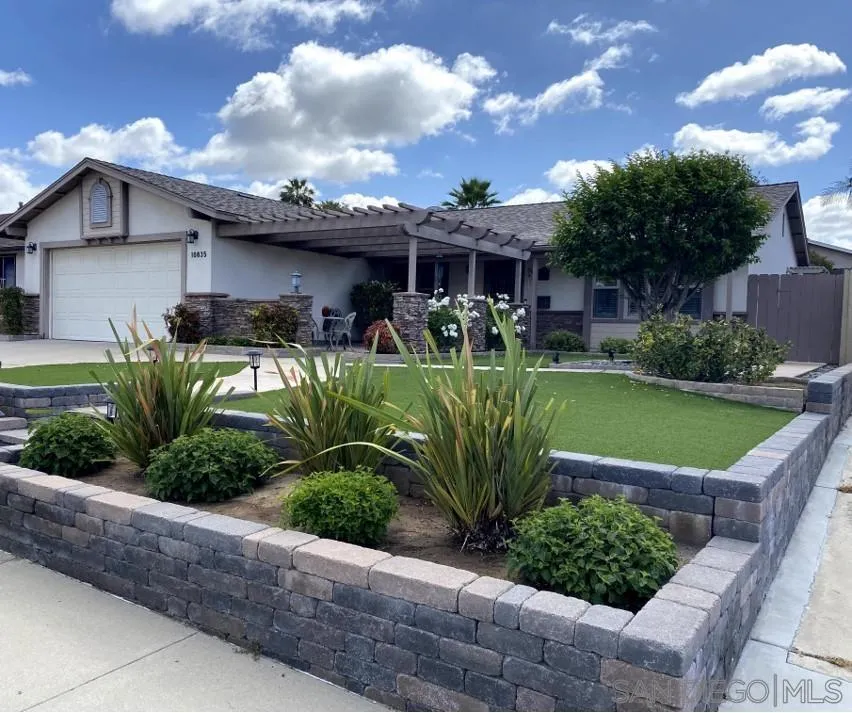 10835 Singletree Lane Spring Valley, CA 91978 - Photo 4 of 31 a front view of a house with garden