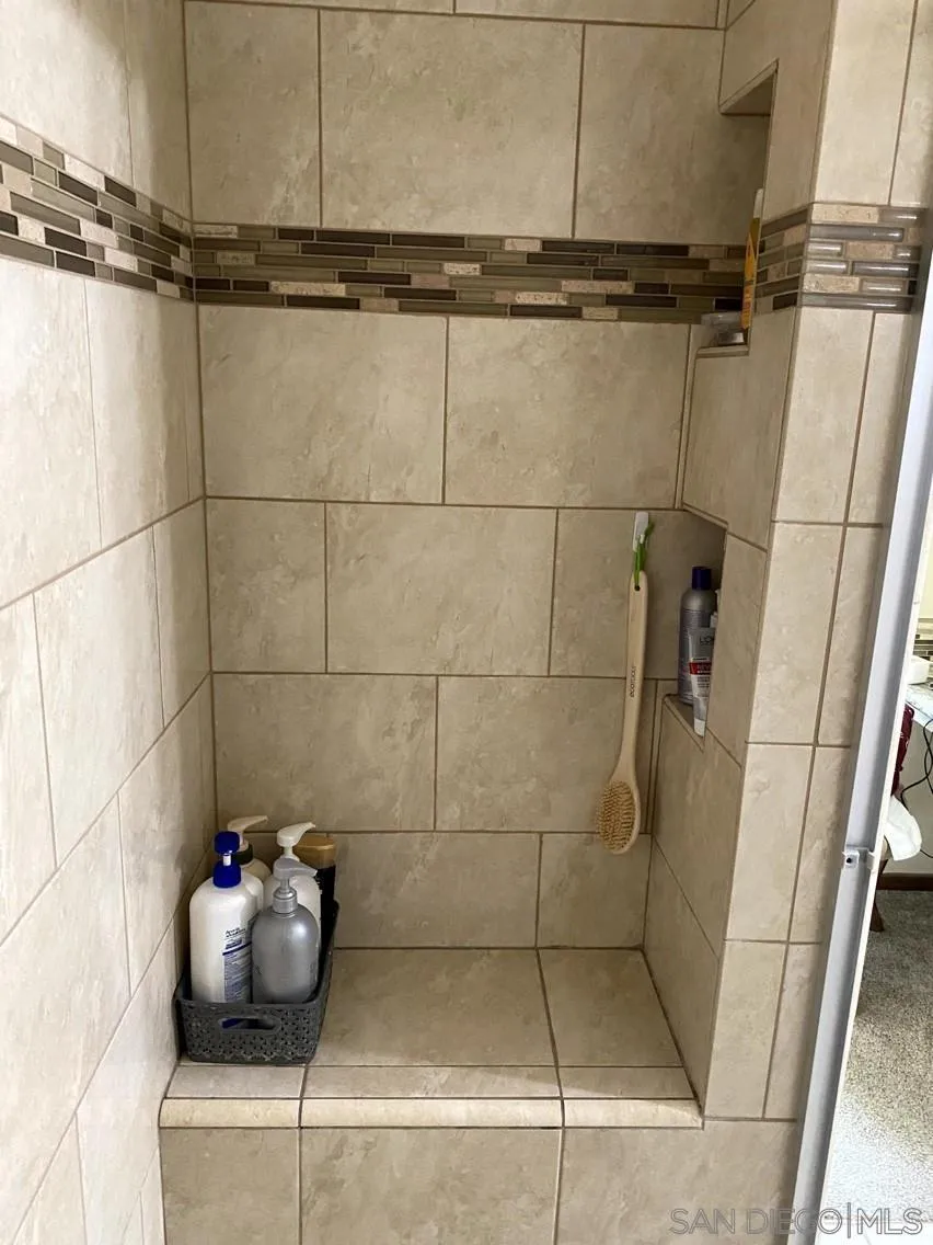 10835 Singletree Lane Spring Valley, CA 91978 - Photo 5 of 31 a bathroom with a shower