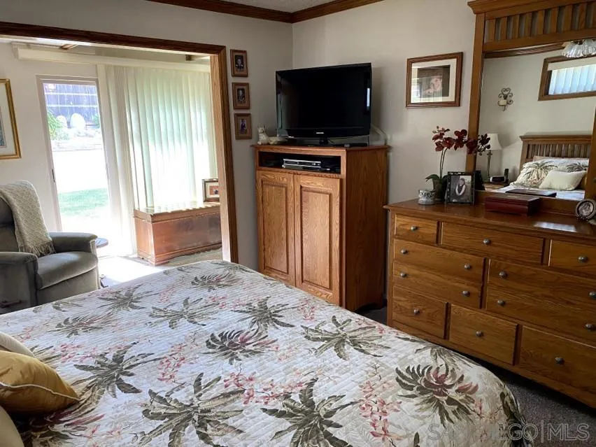 10835 Singletree Lane Spring Valley, CA 91978 - Photo 6 of 31 a bedroom with a bed and a television