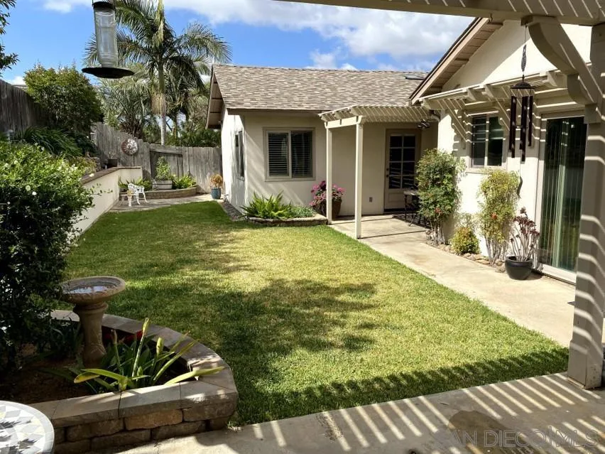 10835 Singletree Lane Spring Valley, CA 91978 - Photo 7 of 31 a view of a house with backyard and sitting area