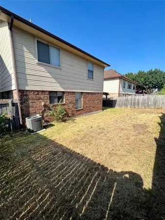 a view of a house with pool and sitting area