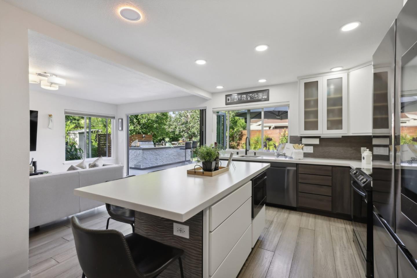 201 Prague Drive San Jose, CA 95119 - Photo 23 of 77 a kitchen with sink cabinets and wooden floor