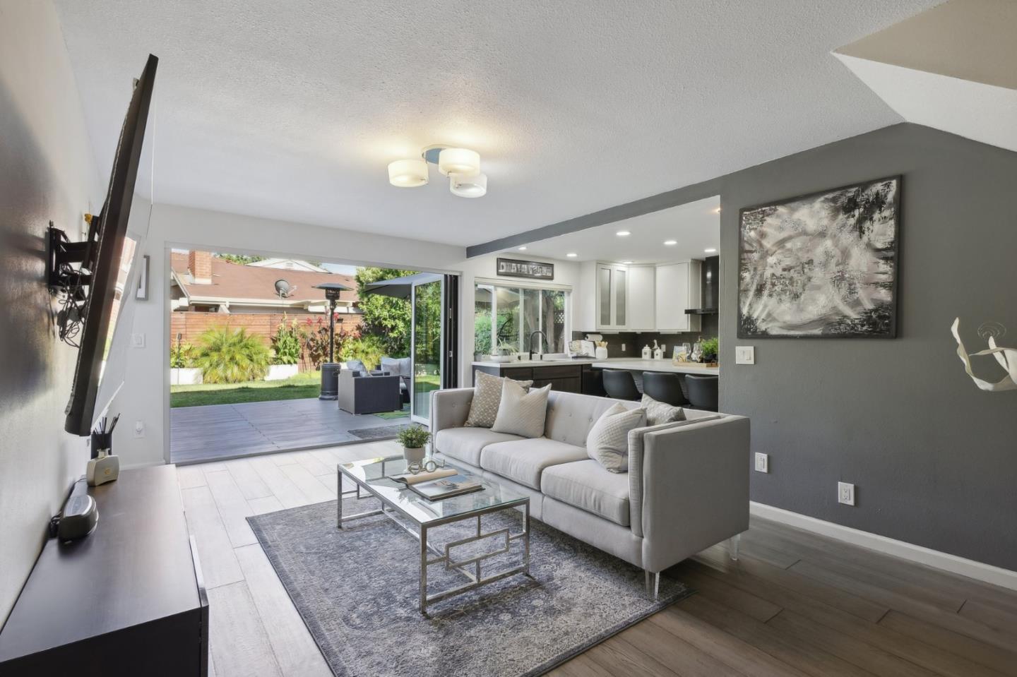 201 Prague Drive San Jose, CA 95119 - Photo 28 of 77 a living room with furniture and a flat screen tv