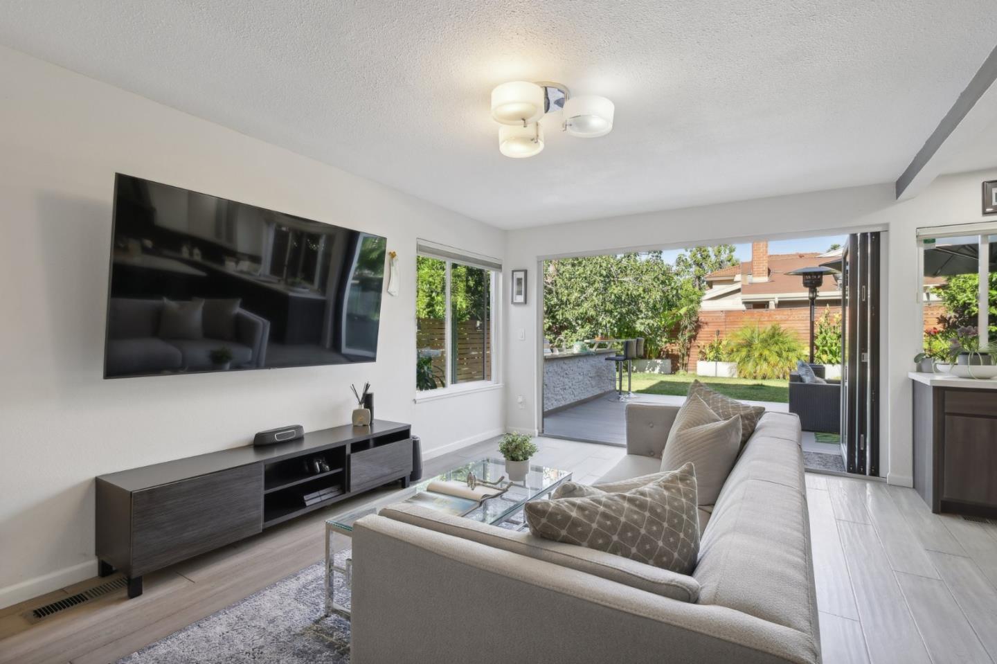 201 Prague Drive San Jose, CA 95119 - Photo 29 of 77 a living room with furniture fireplace and a flat screen tv