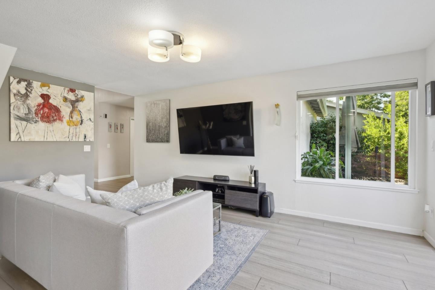 201 Prague Drive San Jose, CA 95119 - Photo 30 of 77 a living room with furniture and a flat screen tv