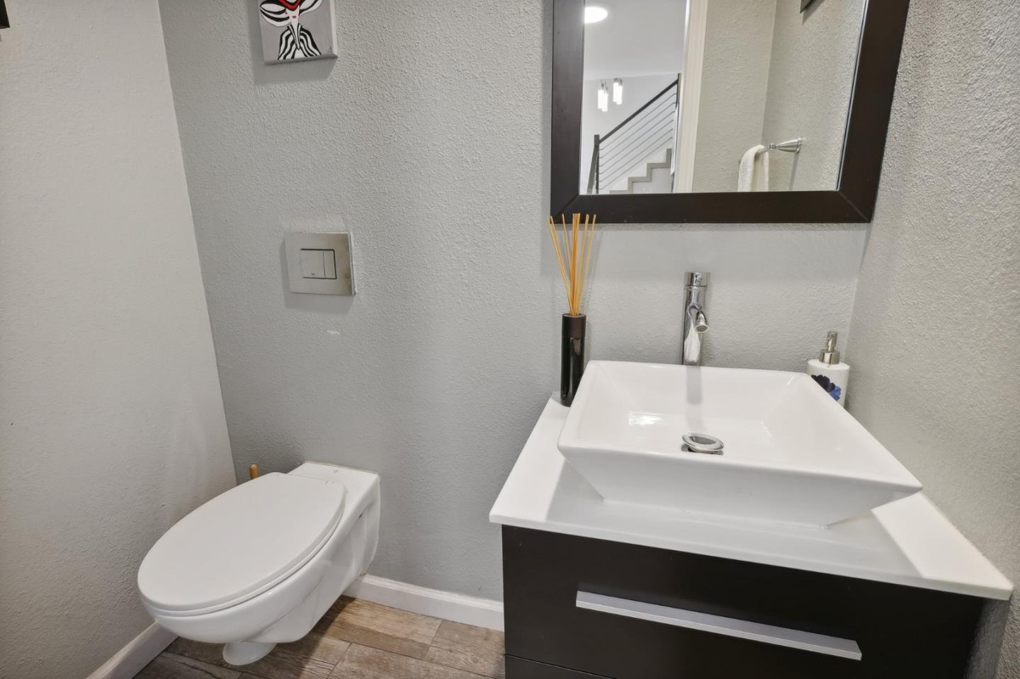 201 Prague Drive San Jose, CA 95119 - Photo 32 of 77 a bathroom with a sink a toilet and mirror