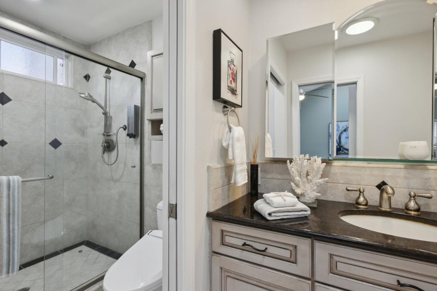 201 Prague Drive San Jose, CA 95119 - Photo 34 of 77 a bathroom with a granite countertop sink toilet and shower
