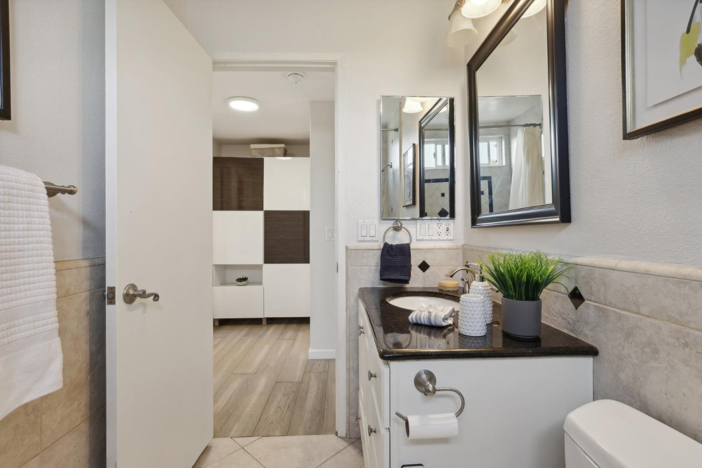 201 Prague Drive San Jose, CA 95119 - Photo 38 of 77 a bathroom with a sink a toilet and mirror