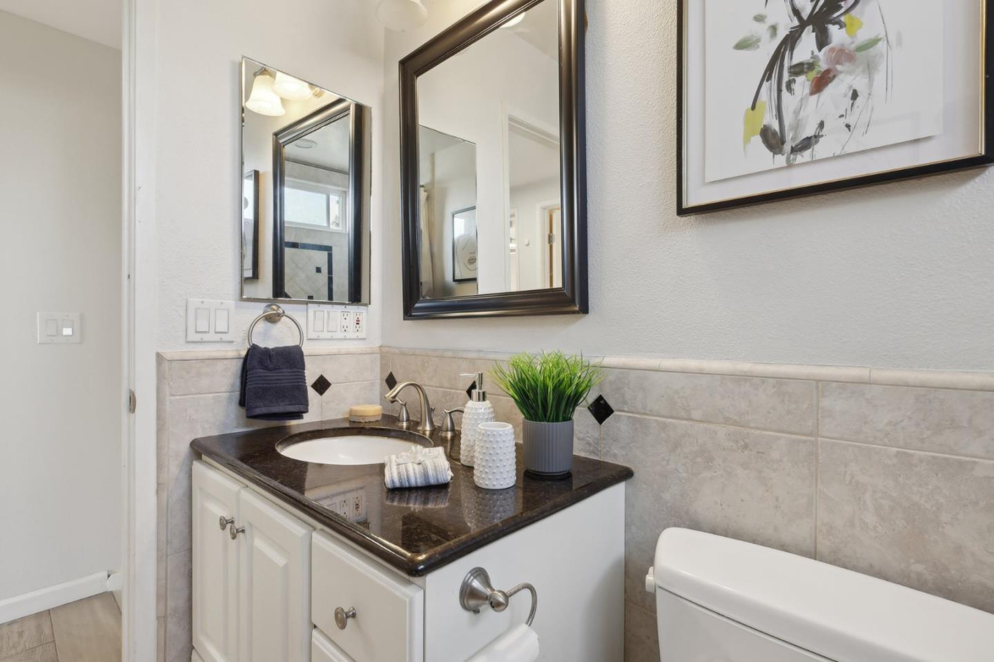 201 Prague Drive San Jose, CA 95119 - Photo 39 of 77 a bathroom with a sink and a mirror