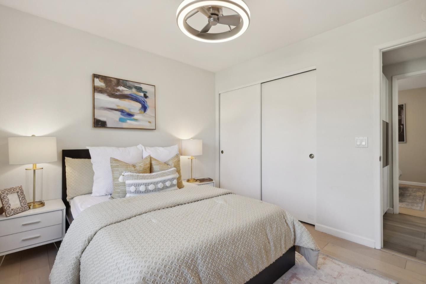 201 Prague Drive San Jose, CA 95119 - Photo 44 of 77 a bedroom with a bed and a chandelier