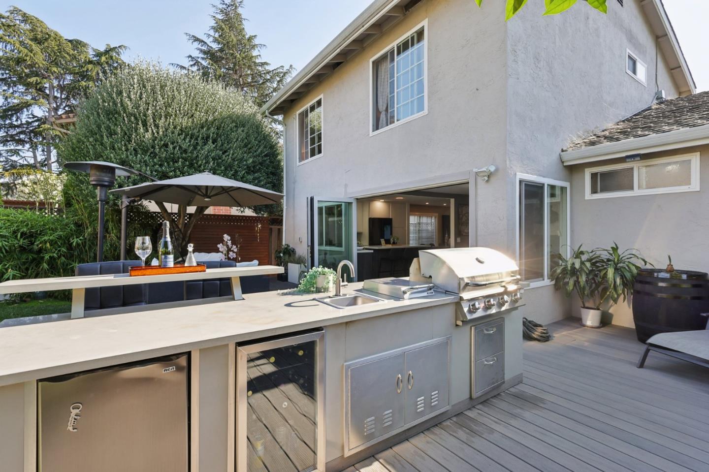 201 Prague Drive San Jose, CA 95119 - Photo 58 of 77 a view of a patio with table and chairs potted plants with wooden floor