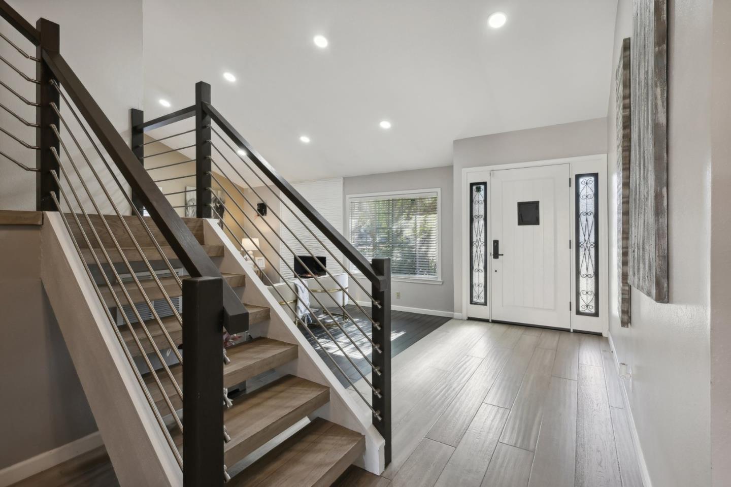 201 Prague Drive San Jose, CA 95119 - Photo 7 of 77 a view of an entryway with wooden floor and stairs