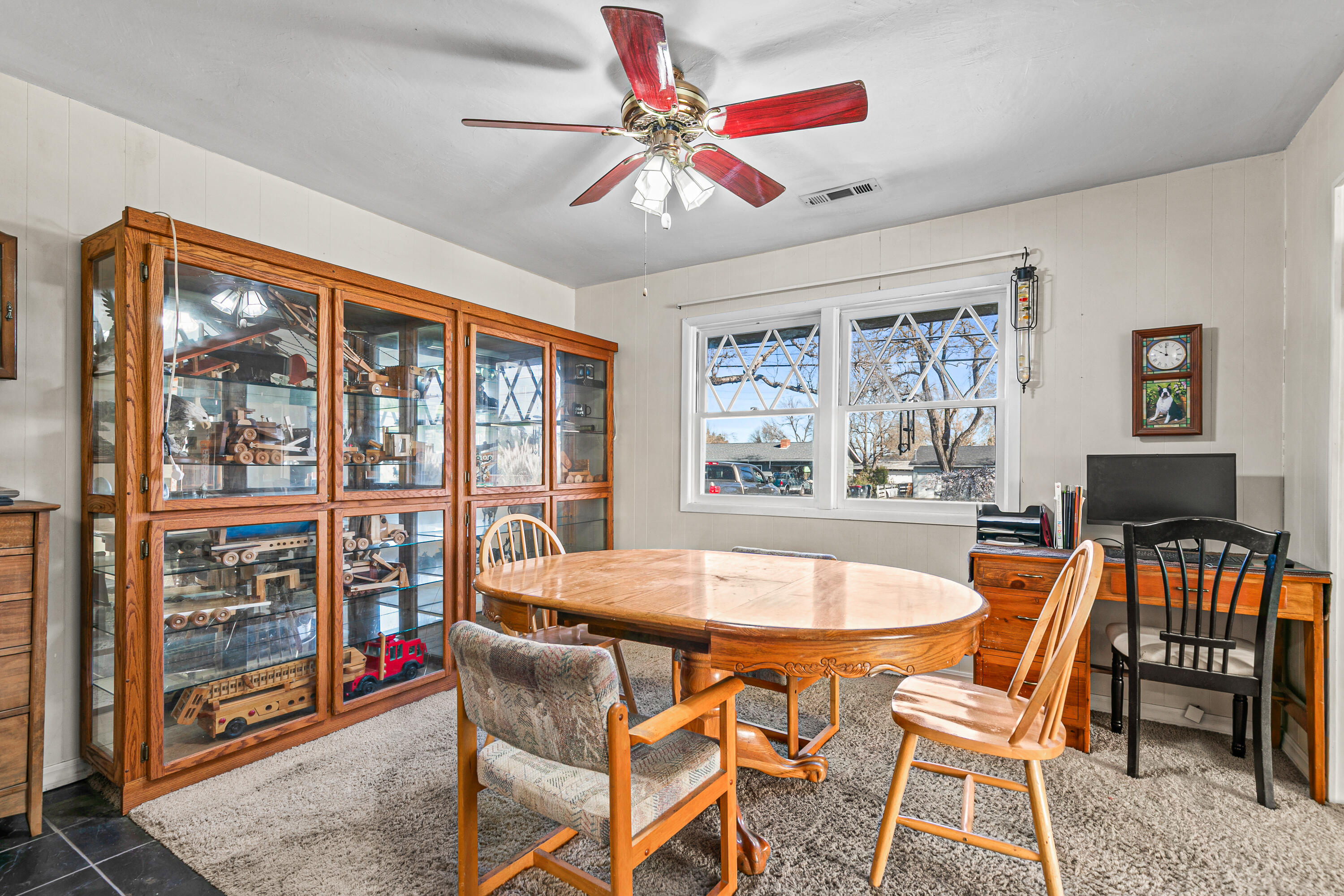 3200 Hanley Road Central Point, OR 97502 - Photo 8 of 25 a dining room with furniture a chandelier and wooden floor