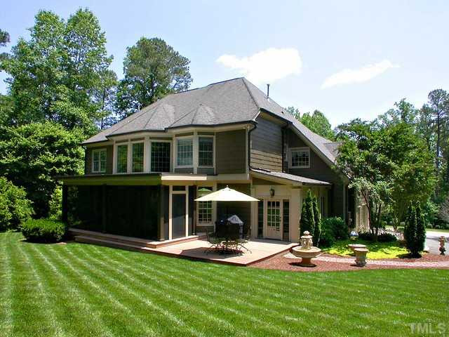 1528 Tradescant Court Raleigh, NC 27613 - Photo 3 of 25 View of back of house and Coastal Screening fiberglass screen porch (10 x 25) with Trex decking, recessed lighting, and 2 ceiling fans. Exterior Back