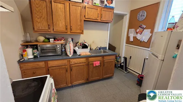 a kitchen with a stove and a refrigerator