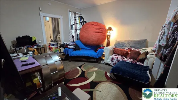 a bed room with a bed and a television