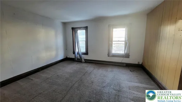 an empty room with windows