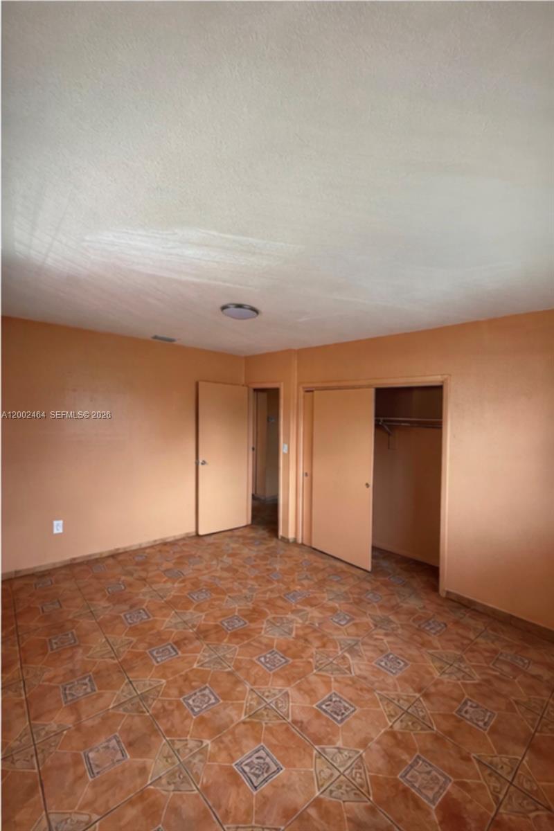 185 Northwest 82nd Street, Unit 1 Miami, FL 33150 - Photo 12 of 13 a view of an empty room