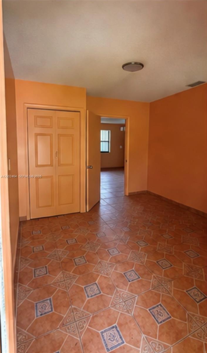 185 Northwest 82nd Street, Unit 1 Miami, FL 33150 - Photo 5 of 13 a view of an empty room