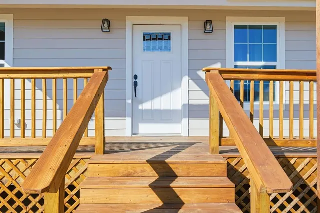 a view of staircase with large windows