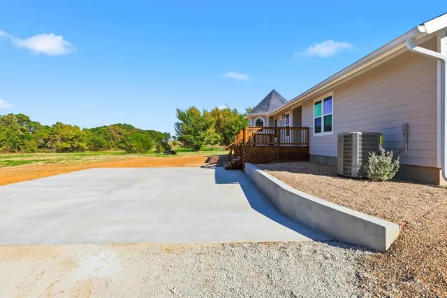 a view of swimming pool with an outdoor seating and a yard