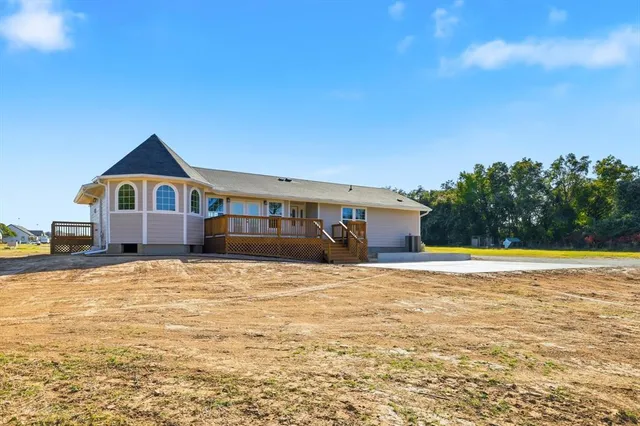 a big house with swimming pool in front of it