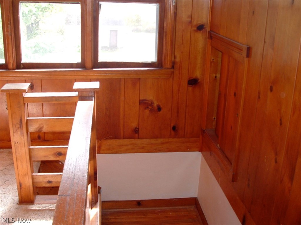 4486 Hayes Road Ravenna, OH 44266 - Photo 14 of 26 Knotty pine stairway to two upstairs bedroom. Triple window, solid and sturdy railing system.