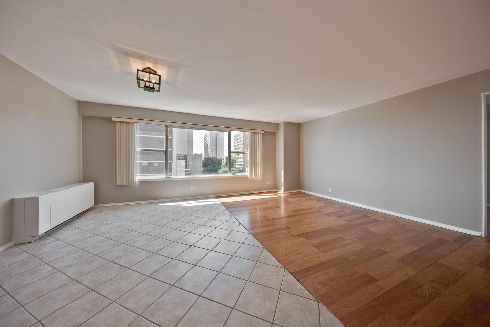 6157 North Sheridan Road, Unit 4M Chicago, IL 60660 - Photo 4 of 4 a view of an empty room with a window