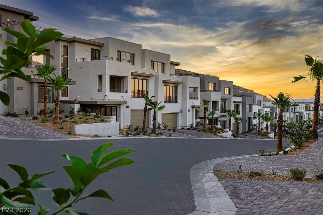 11027 Socrates Ridge Street Las Vegas, NV 89141 - Photo 11 of 20 Modern desert architecture with a view, where sleek lines meet the dramatic sunset.