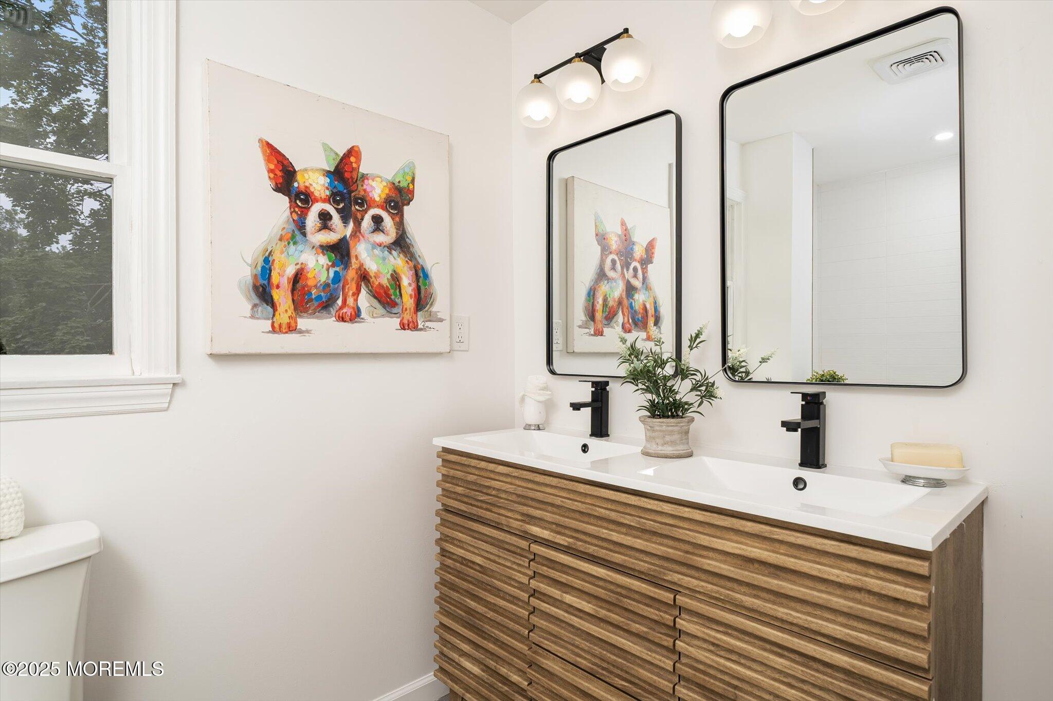 35 Waldron Road Allentown, NJ 08501 - Photo 24 of 39 a bathroom with a sink and a mirror