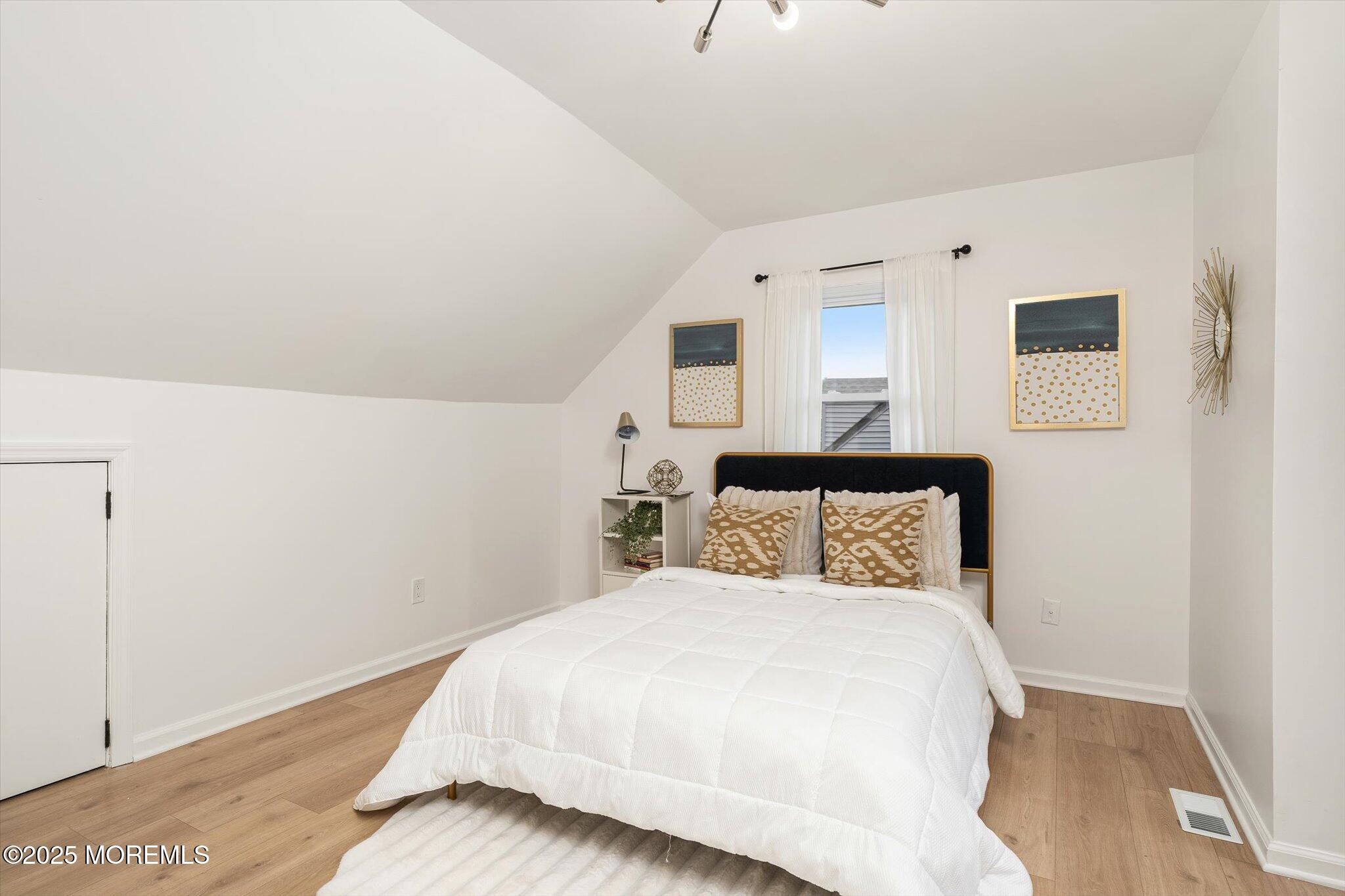 35 Waldron Road Allentown, NJ 08501 - Photo 26 of 39 a bedroom with a bed and a painting on the wall
