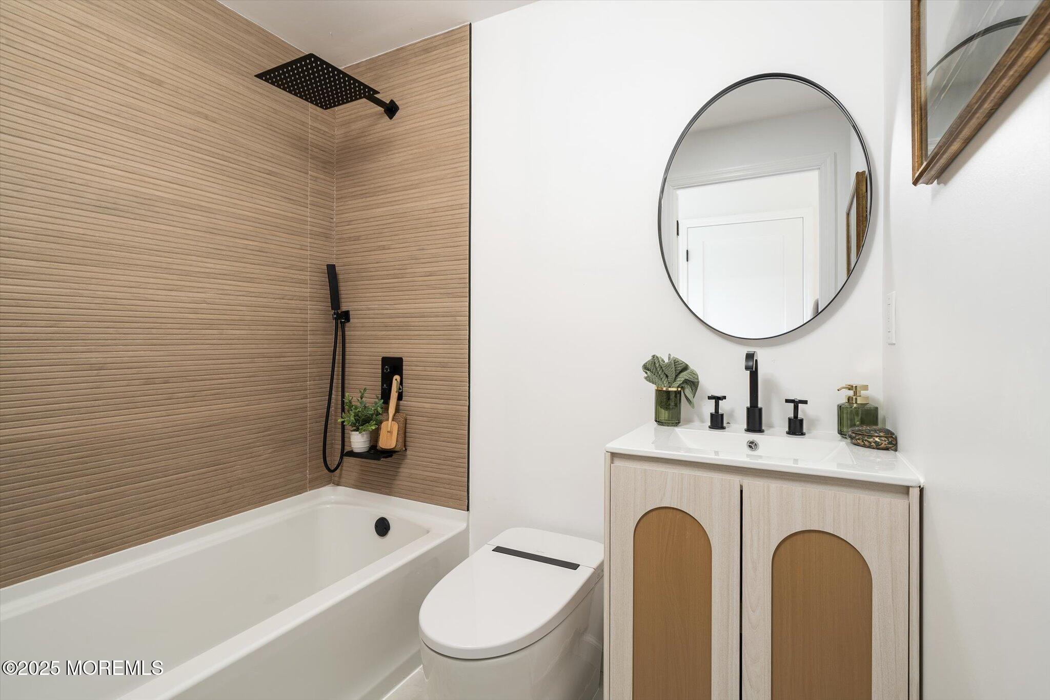 35 Waldron Road Allentown, NJ 08501 - Photo 28 of 39 a bathroom with a toilet a sink a mirror and bathtub