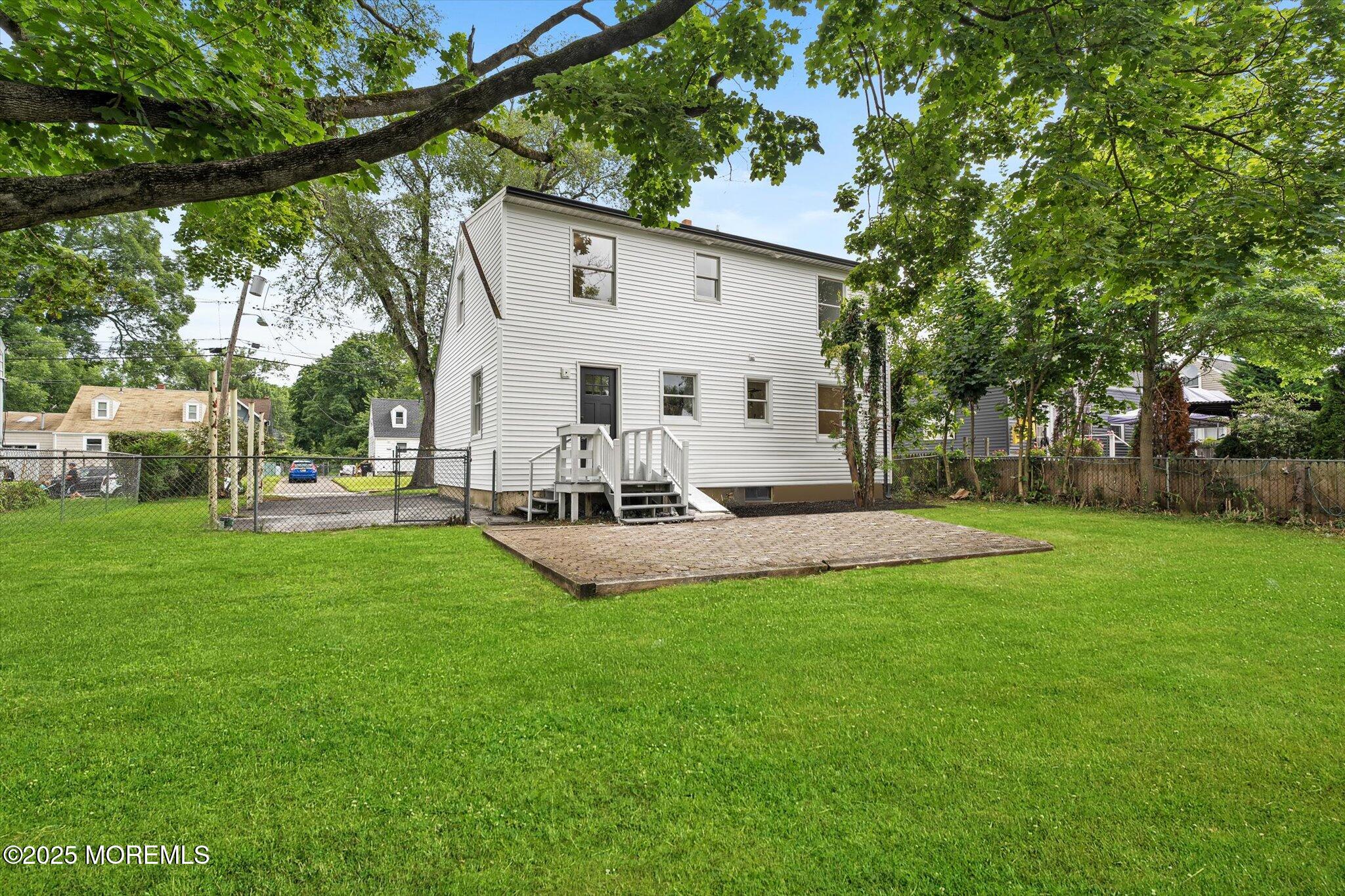 35 Waldron Road Allentown, NJ 08501 - Photo 35 of 39 a view of a white house with a big yard and a large tree