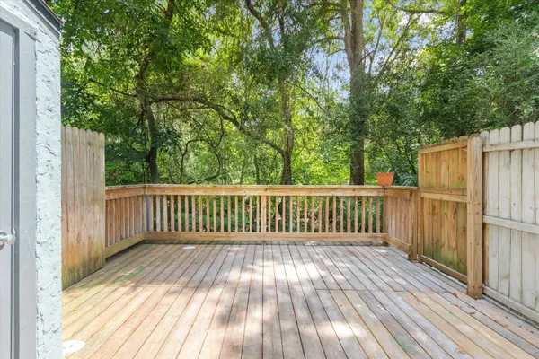 a view of deck with wooden floor and fence