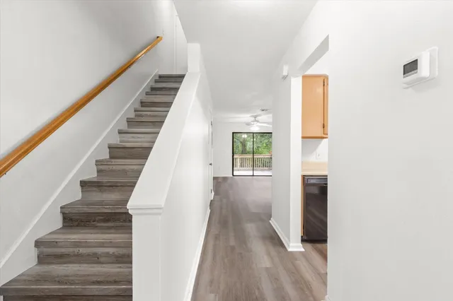 a view of entryway and hall with wooden floor