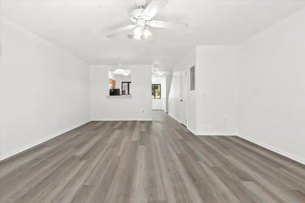 wooden floor in an empty room with a window