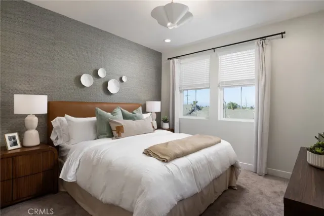 a bedroom with bed and window