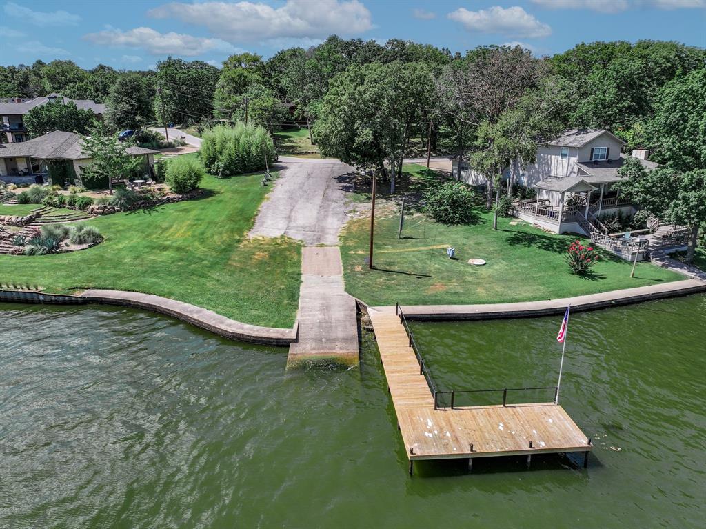 Tbd Inner Circle Tool, TX 75143 - Photo 7 of 24 Dock area with a water view and a lawn