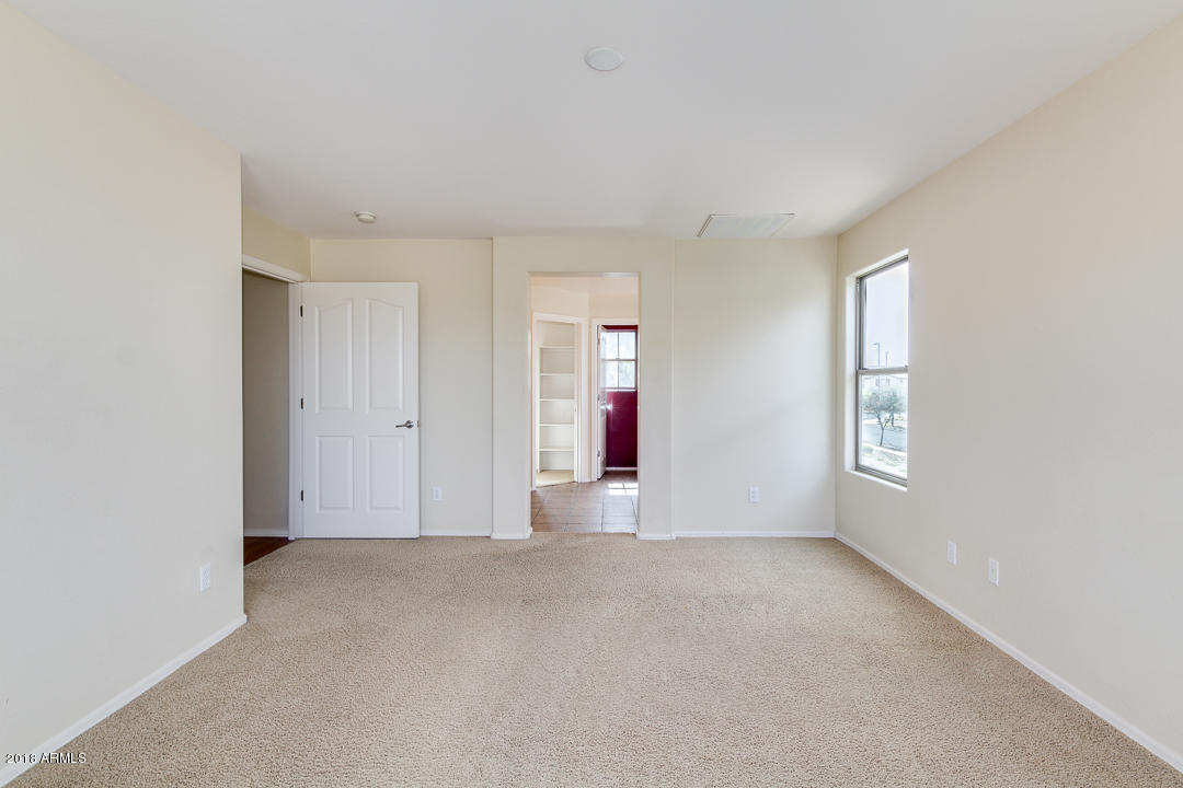 4526 East Del Rio Street Gilbert, AZ 85295 - Photo 8 of 29 an empty room with windows and entrance