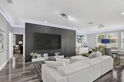 a kitchen with stainless steel appliances granite countertop a sink a stove and refrigerator